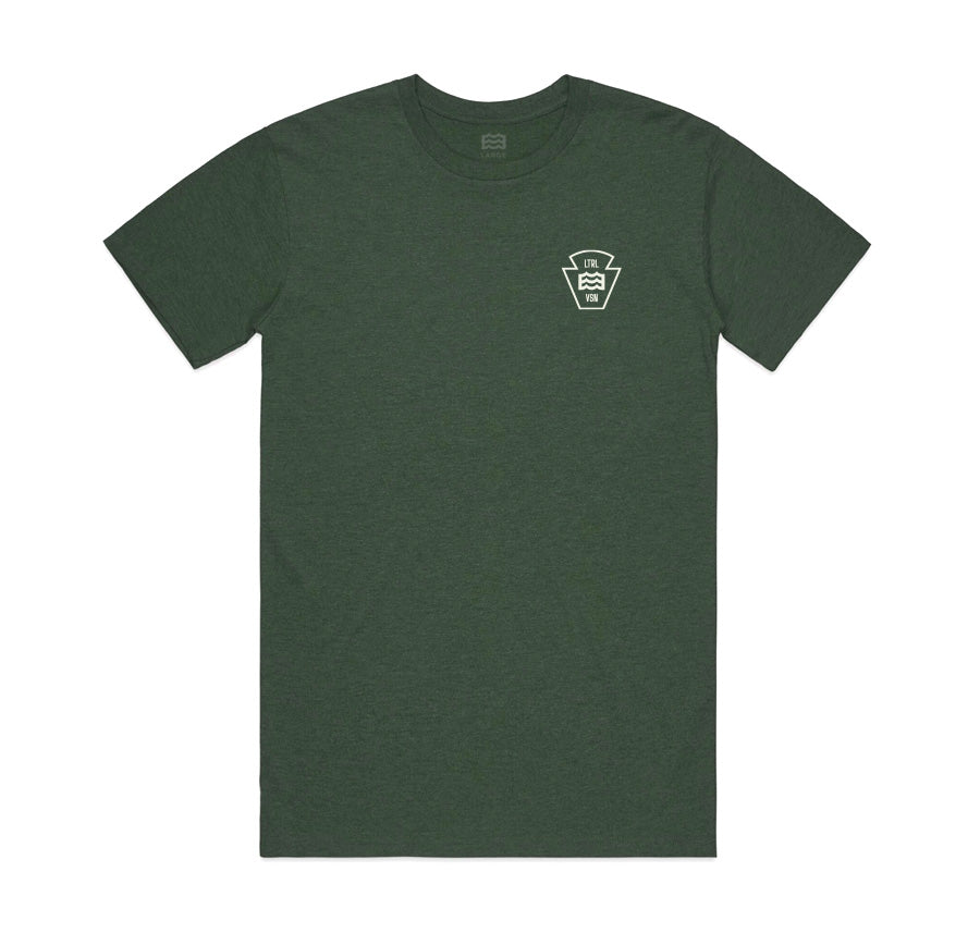 front of green t-shirt with lateral vision wave logo on pocket
