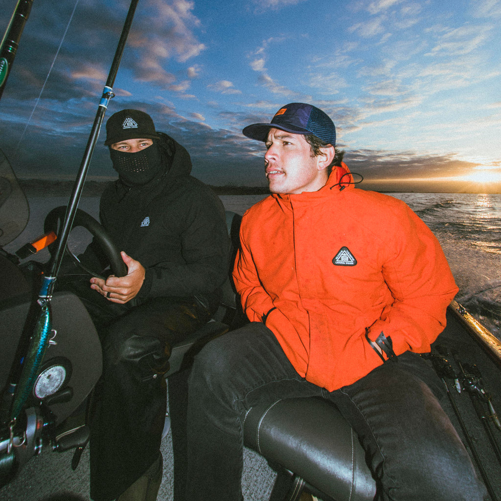 two men sitting on fishing boat 
