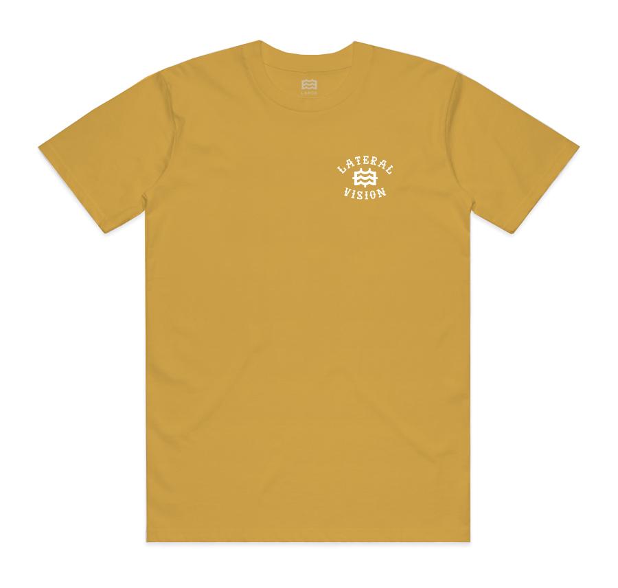 front of gold t-shirt with lateral vision name and logo on pocket 