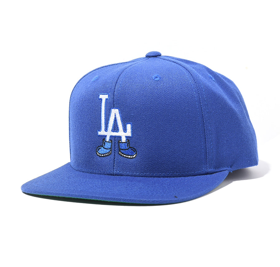 blue snapback hat with "LA" wearing shoes design 