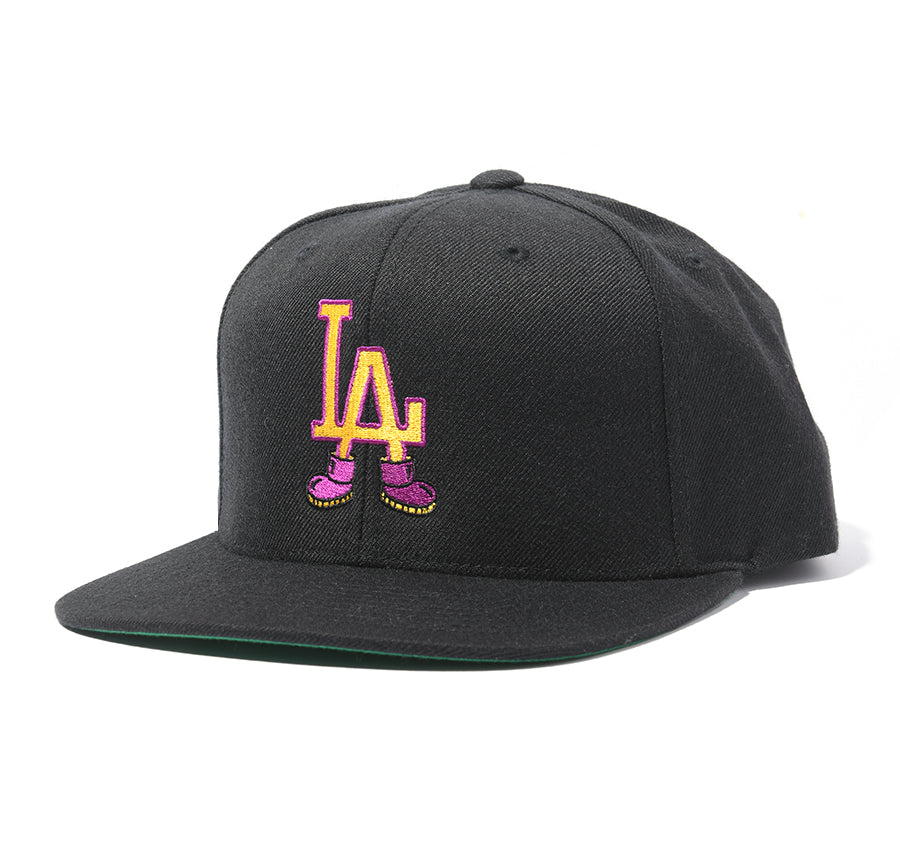 black snapback hat with "LA" wearing shoes design 