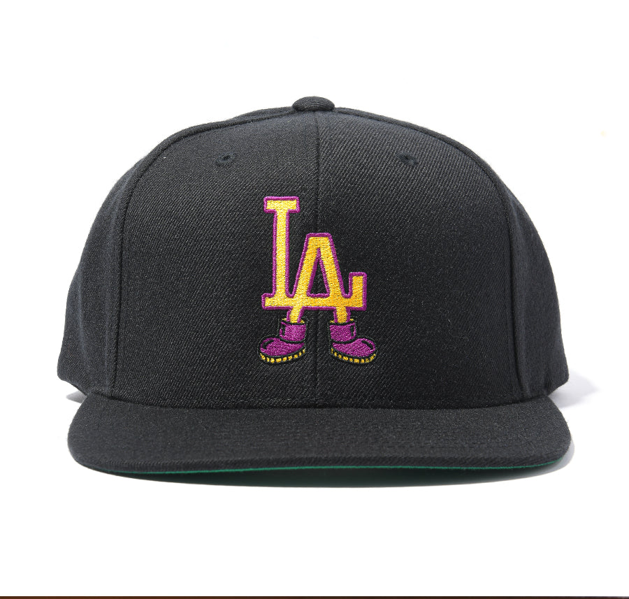 black snapback hat with "LA" wearing shoes design 