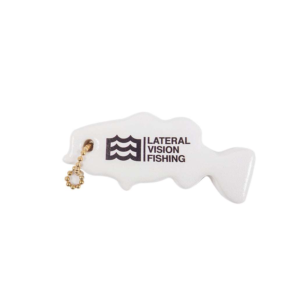 white floating keychain in fish shape with lateral vision fishing logo