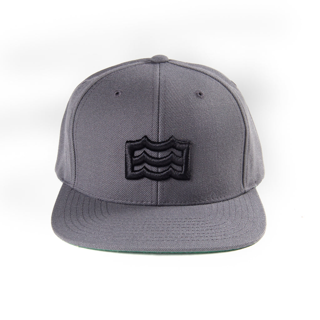 charcoal snapback with black woven wave logo