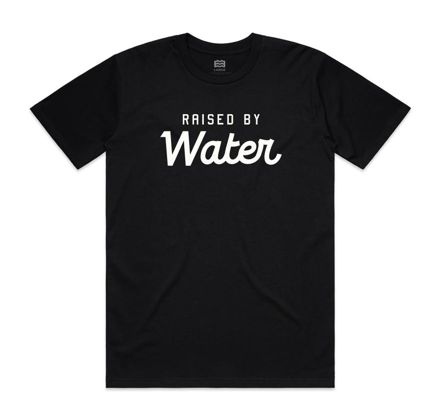 black t-shirt with "raised by water" in white