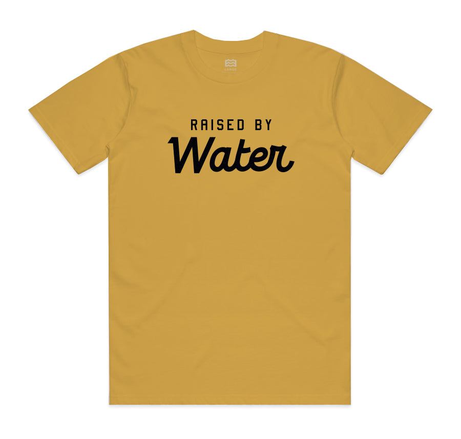 gold t-shirt with "raised by water" in black